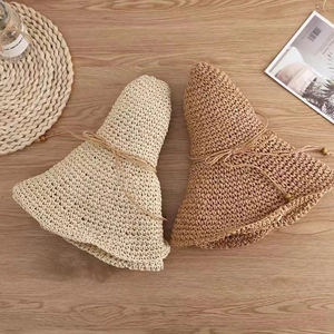 Foldable wide brim straw sun hats for women with ribbon ties in beige and light brown