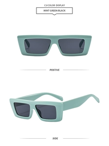 Detail view of stylish mint green rectangular sunglasses with black lenses and smooth frame