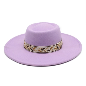 Detail of lavender wool fedora hat featuring an ethnic woven geometric decorative band