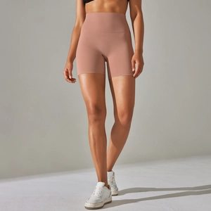 Detail of high-waist yoga shorts in soft pink breathable fabric with skin-friendly texture