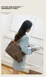 Detail of vintage brown checkered tote bag set with matching small pouch and long straps