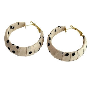 Vintage polka dot fabric wrapped hoop earrings with gold metal clasp in retro style