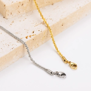 Sparkling stainless steel braided bracelets in gold and silver with lobster clasps