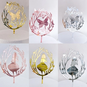 Macro detail of acrylic Happy Birthday cake toppers in gold, rose gold and silver mirror