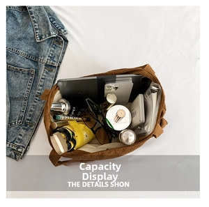 Spacious interior of brown corduroy tote bag showing capacity for daily essentials