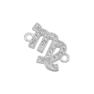Macro detail of silver Virgo zodiac connector link with pavé cubic zirconia stones