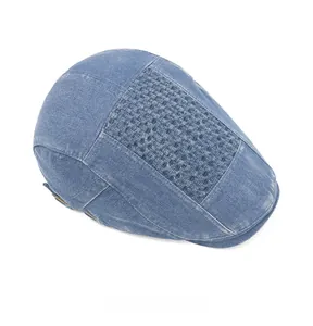 Top view of denim newsboy hat showing intricate woven texture on the blue crown