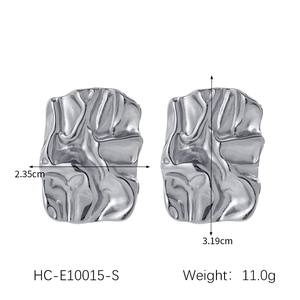 Silver lava textured earrings with 2.35cm width and 3.19cm height dimensions shown