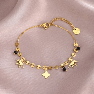 Elegant gold-tone stainless steel clover bracelet with black beads on pink silk