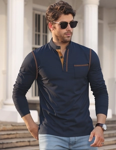 Detail of navy blue long sleeve henley shirt with contrasting tan collar and chest pocket