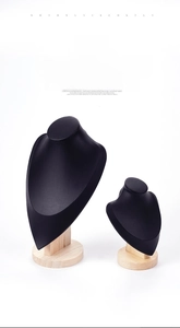 Macro view of black mannequin necklace display stands with premium wooden bases in two sizes