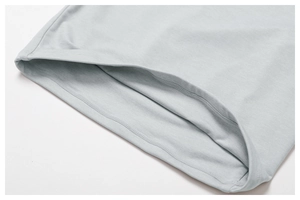 Close-up of double-needle stitching on light gray quick-dry athletic yoga top hem