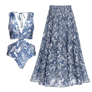 Blue dragonfly floral swimsuit with a matching tiered ruffle skirt resort set