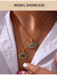 Detailed view of evil eye necklaces with colorful enamel and sparkling zircon accents