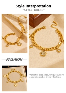 Detail of double-layer gold chain bracelet with flower and teardrop crystal pendants