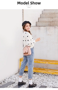 Outdoor model shot showing the fit and pink design of this mini fashion backpack