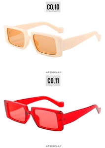 Details von quadratischen Vintage-Sonnenbrillen in Cremeweiß-Orange und Transparent-Rot