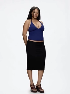 Detail of slim fit navy halter top with deep V-neckline and high quality fabric texture