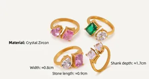 Detail of gold-plated rings with colorful zircon crystals and specific size measurements