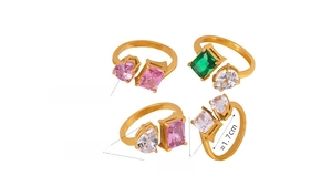 Detail of gold-plated rings with colorful zircon crystals and specific size measurements