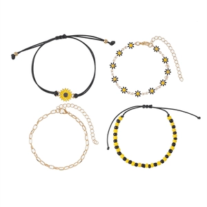 Colorful floral pendant bracelet and anklet set with sunflower charms on white background