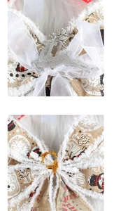 Detailed view of white mesh and khaki linen Christmas bows with festive Let It Snow print