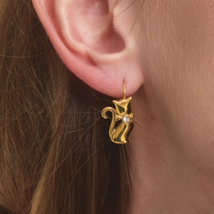 Exquisite 18K gold cat earrings featuring a sleek silhouette and tiny zircon accent