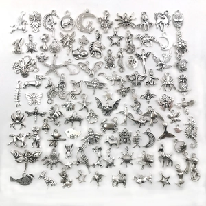 Various vintage silver alloy charms for DIY jewelry making including owl and star shapes