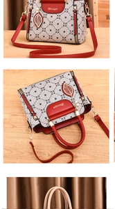 Close-up of stylish handbag with pattern拼接 and elegant metal leaf pendant detail