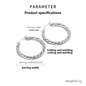 Macro shot of polished stainless steel twisted hoop earrings with 30mm diameter