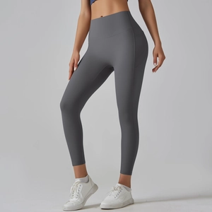 Detail of high-waisted yoga leggings featuring side pockets and ergonomic stitching