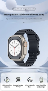 Macro detail of black silicone ocean band with wave design and silver buckle for Apple Watch