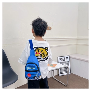 Blue school bus chest bag for kids showing back view on model for size and fit