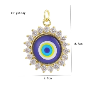 Detail view of 18K gold plated sun evil eye charm with micro-pave crystals and measurements