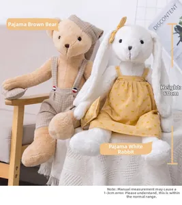 Detail of 60cm teddy bear in plaid overalls and bunny plush toy in heart print nightgown