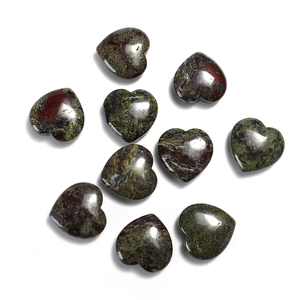 Macro detail of ten 20mm heart-shaped green and brown mottled natural stone crystals