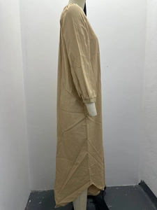 Side view of khaki cotton linen long sleeve maxi dress featuring a round neck and loose fit