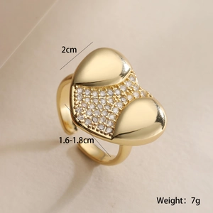Macro detail of 18K gold plated heart ring with zircon inlay and product measurements