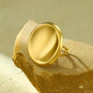 Polished 18K gold-plated geometric round ring on stone, modern minimalist style