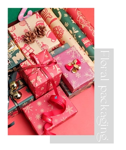 Detail of Christmas kraft wrapping paper and ribbons with festive snowflake and tree patterns