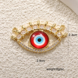 Detailed macro view of red evil eye pendant with dimensions 2.3cm by 2.9cm and 6g weight