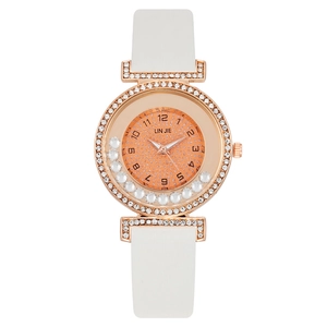 Fashionable rose gold women's quartz watch with floating rhinestones and white strap