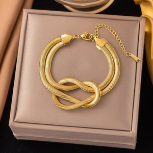 18K gold plated stainless steel double snake chain bracelet with a central knot design