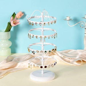 White 4-tier rotating metal jewelry stand with 130 holes for earring storage and display
