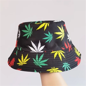 Reversible bucket hat with colorful leaf print on black fabric for summer sun protection