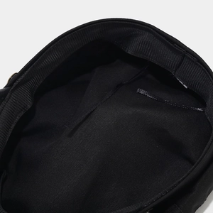 Macro detail of the black vintage sailor cap featuring a ribbed interior sweatband