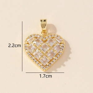 Detailed size view of a gold heart pendant with cubic zirconia, 2.2cm by 1.7cm