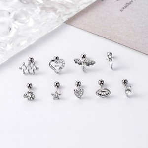 Selection of silver cartilage stud earrings featuring micro-paved zircons in various shapes