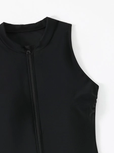 Detail view of a black surfing swimsuit featuring a stand-up collar and front zipper closure