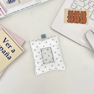 Macro detail of padded blue star card holder with transparent window for photos